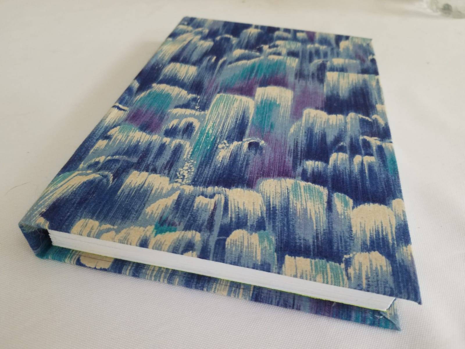 Book with a blue waterfall-esque pattern cover